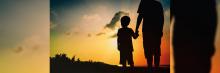 Siluetas de padre e hijo mirando al horizonte